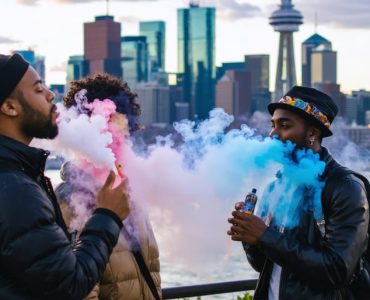 Diverse individuals embracing vaping culture in front of Toronto's vibrant skyline, representing the city's urban and cultural fusion.